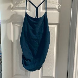 Beyond the bump, by beyond yoga. Blueish green color.